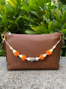 Hebrew Shell, Ilima, Pua Kalaunu, and Pikake Bag Lei