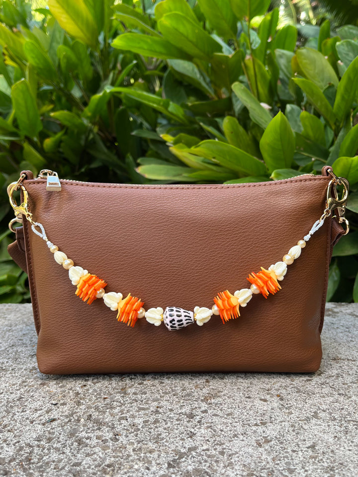 Hebrew Shell, Ilima, Pua Kalaunu, and Pikake Bag Lei