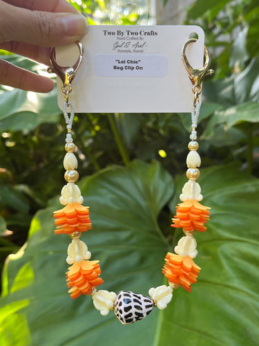 Hebrew Shell, Ilima, Pua Kalaunu, and Pikake Bag Lei